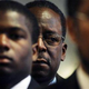 John White, behind son Aaron (AP)